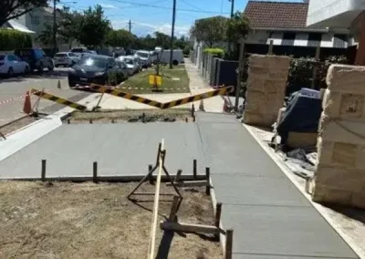 Concreters in Collaroy pouring a residential footpath with formwork still in place