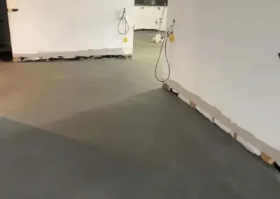 Polished concrete flooring in Avalon Beach curing in an open plan living area before fit-out