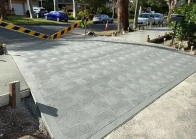 Stamped concrete driveway in Frenchs Forest with a tiled pattern finish fresh off the forms